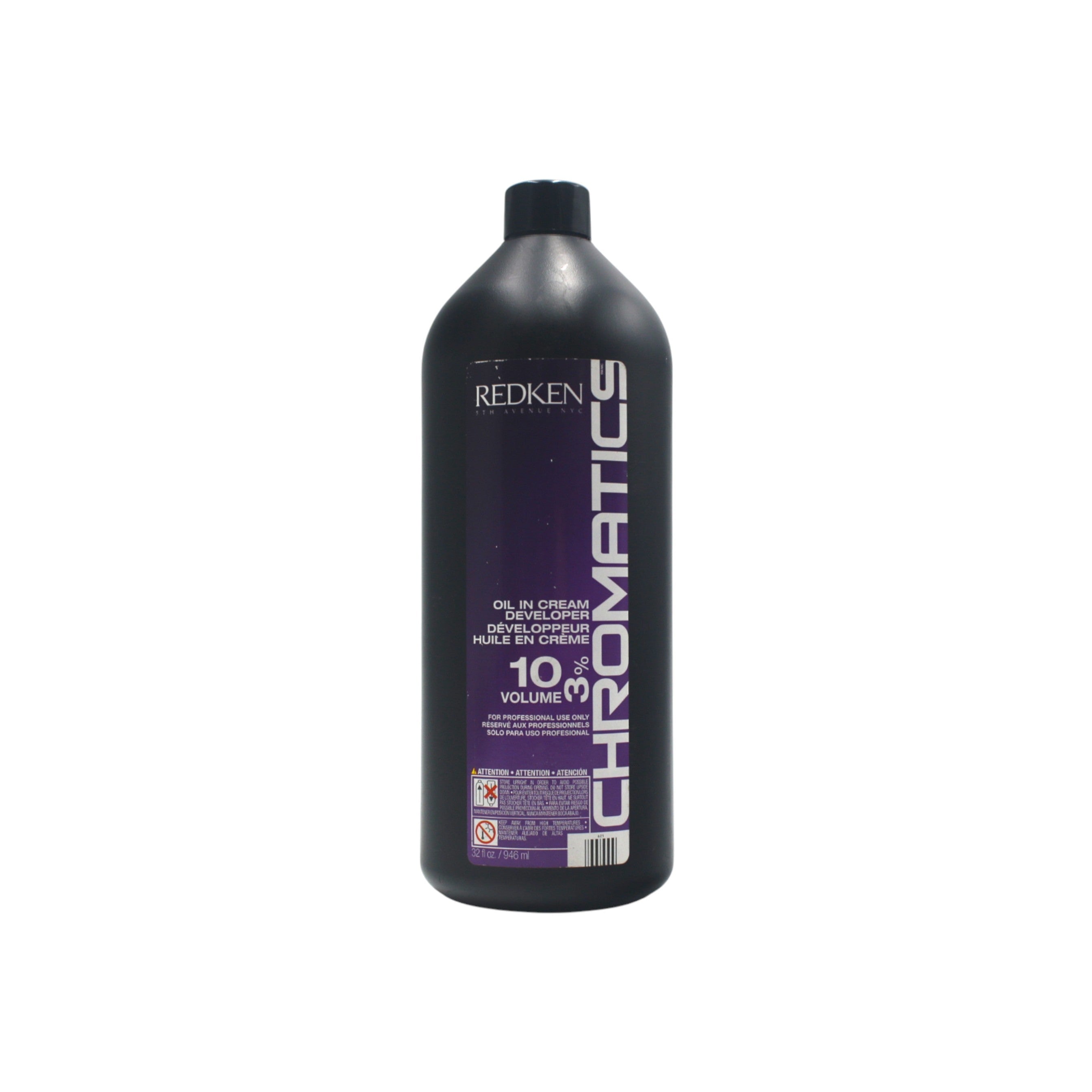 Redken Chromatics hair color bottle on a white background