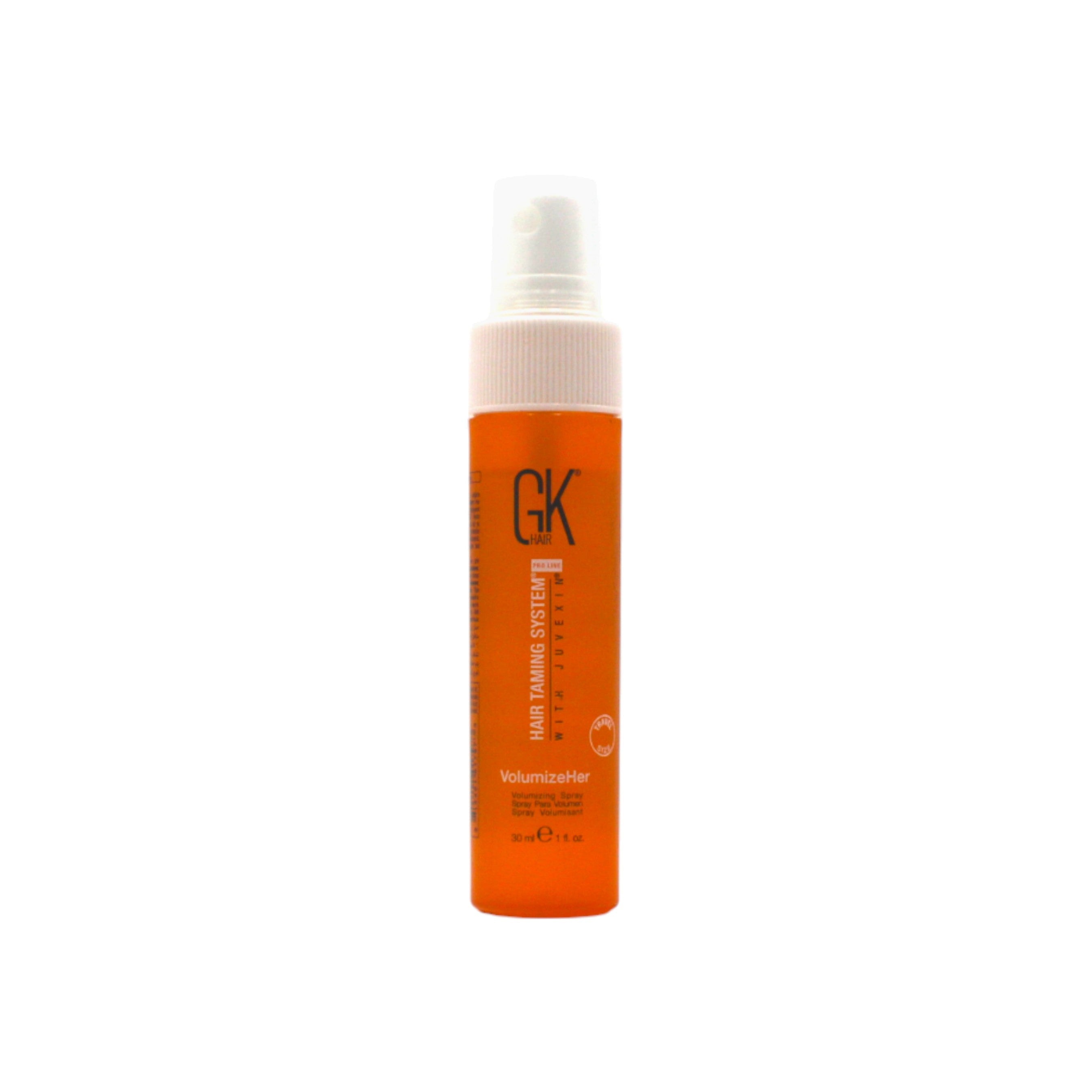Orange spray bottle with white cap on a white background