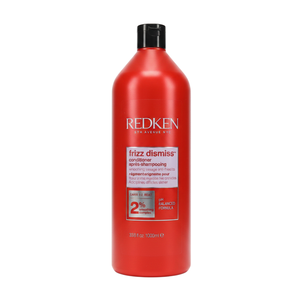 Red bottle of Redken frizz dismiss conditioner on a white background