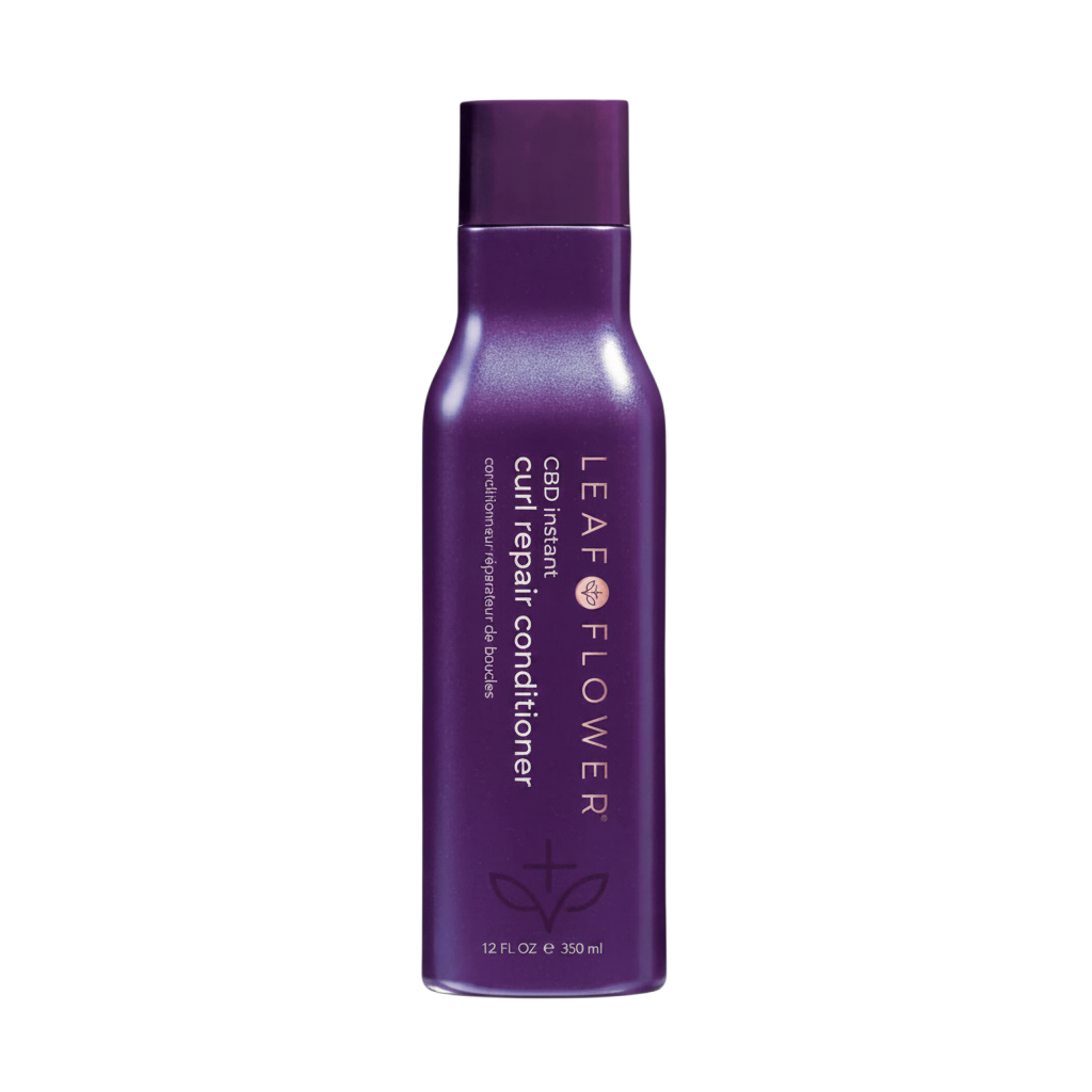 Purple bottle of Leaf & Flower curl repair conditioner on a white background