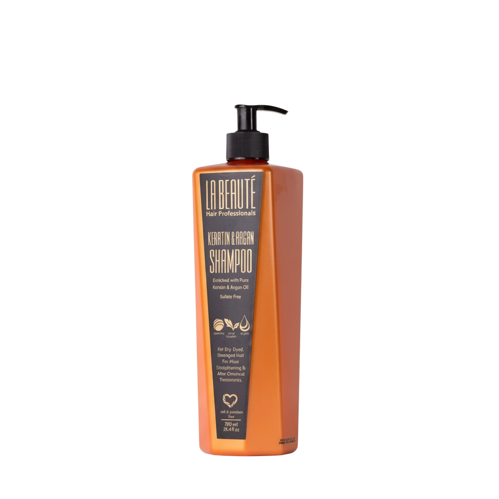 Orange shampoo bottle with black label on a white background