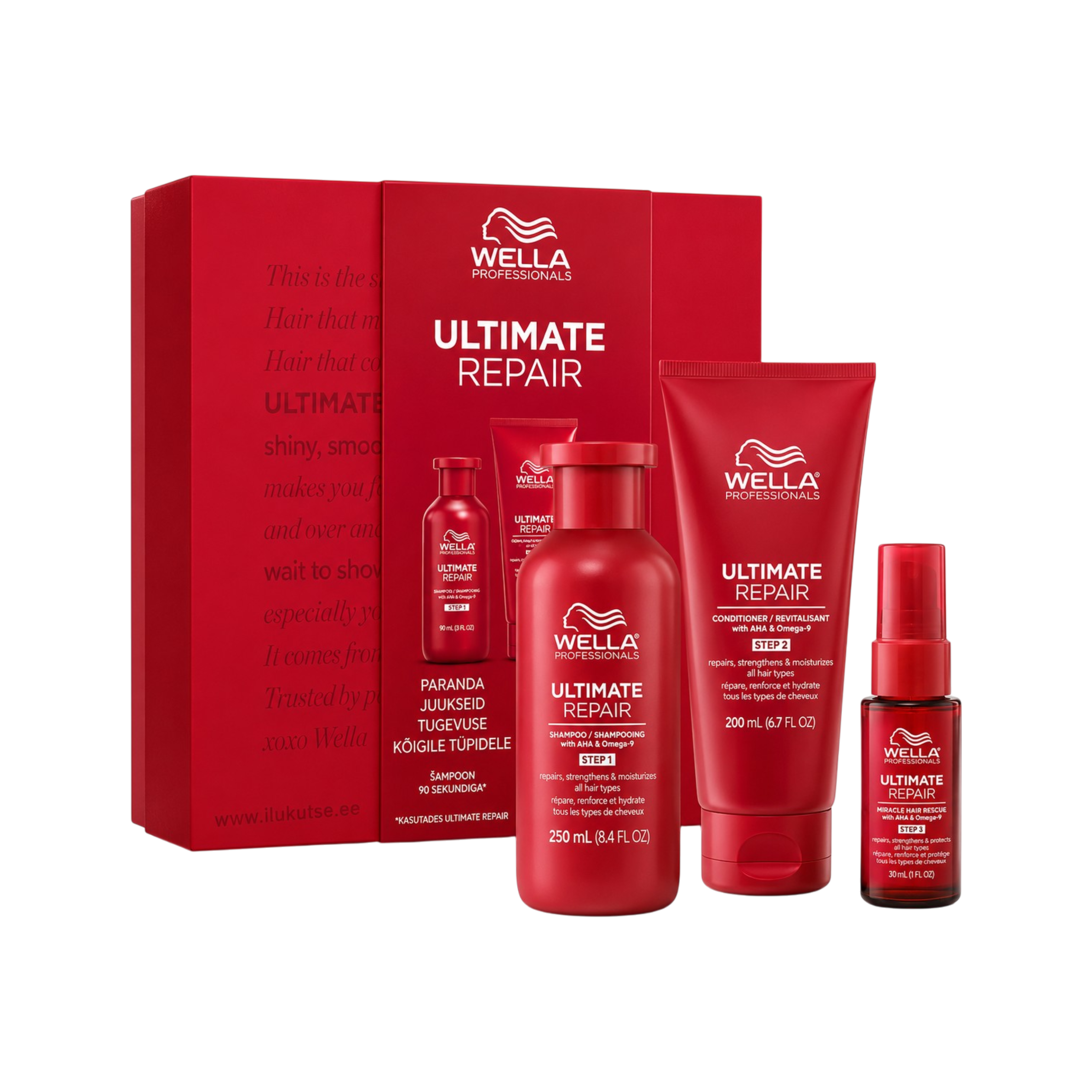 Wella Professionals Ultimate Repair hair care set including a red gift box, shampoo, conditioner, treatment, and spray bottles on a white background.